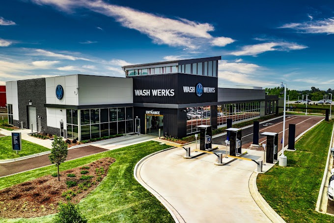 Exterior image of a clean, modern car wash facility with a Wash Werks logo